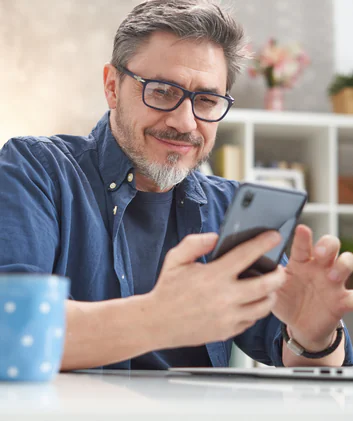 Smiling man on his phone